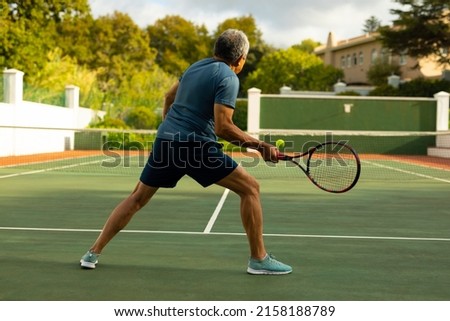 Similar – Image, Stock Photo Senior man playing tennis in gym