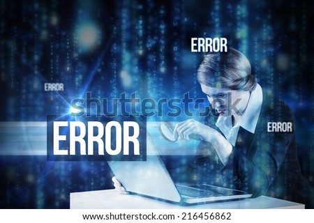 The word error and redhead businesswoman using her laptop against lines of blue blurred letters falling