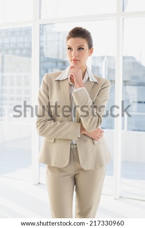 Pretty businesswoman looking to future in her office