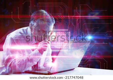 Mature businessman examining with magnifying glass against pink technology square interface design