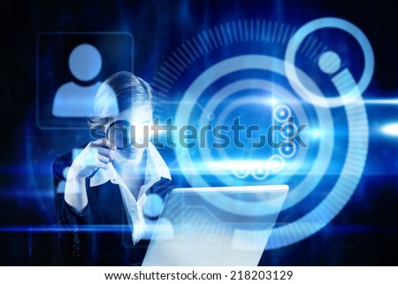 Redhead businesswoman using her laptop against blue technology design with profiles