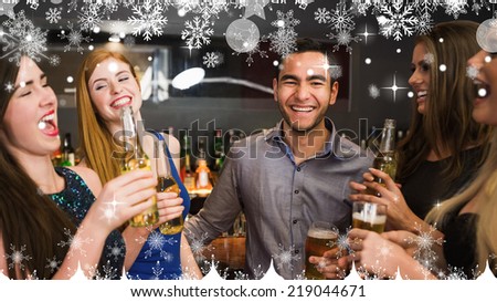 Composite image of a Chatting friends drinking beer against snow falling