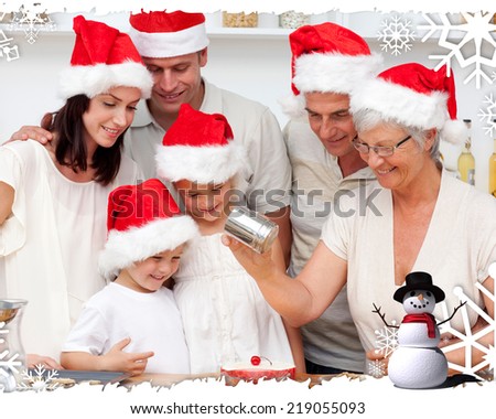Happy family baking Christmas cakes against christmas themed frame