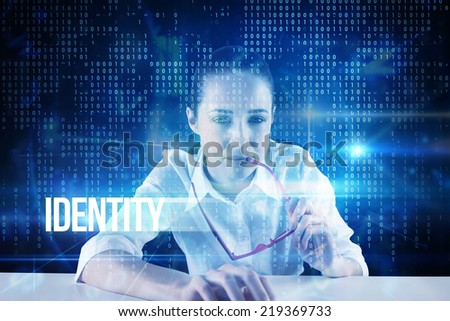 The word identity and businesswoman typing on a keyboard against blue technology interface with binary code