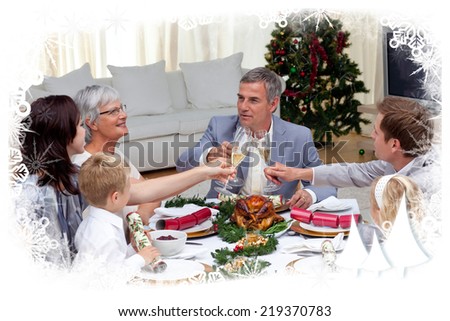 Family tusting in a Christmas dinner with champagne against frost frame