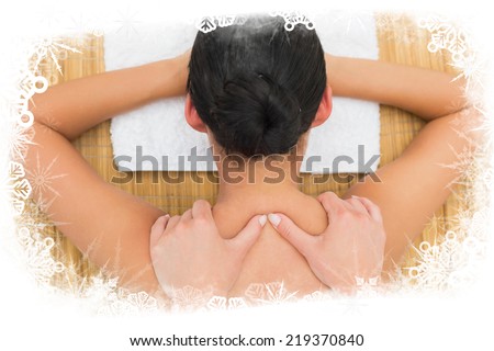 Peaceful brunette enjoying a back massage against frost frame