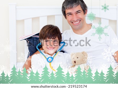 Cheerful father and his sick son playing with a stethoscope against snowflakes and fir trees in green
