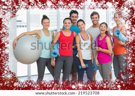 Fit people smiling in a bright exercise room against snow