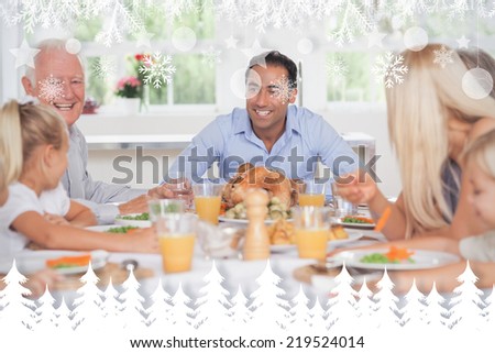 Happy family at thanksgiving against fir tree forest and snowflakes