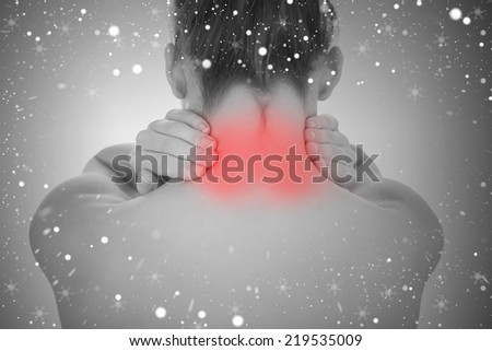Composite image of woman touching highlighted neck pain against snow