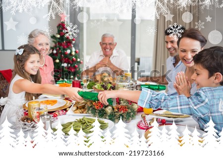 Cheerful family at dining table for christmas dinner against fir tree forest and snowflakes