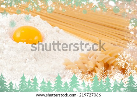 Composite image of snow and fir trees against preparation of the meal