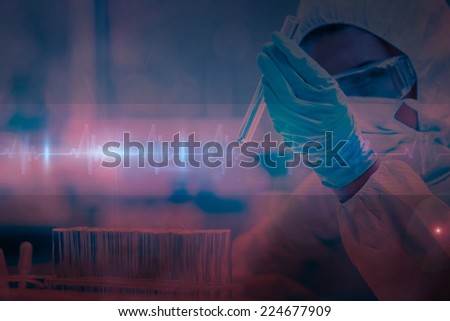 Protected scientist looking at a dangerous liquid in test tubes against ecg line in red and black