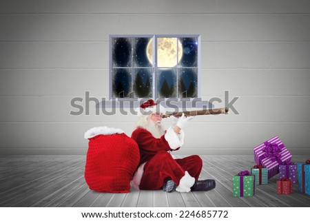 Santa looking through telescope against grey room
