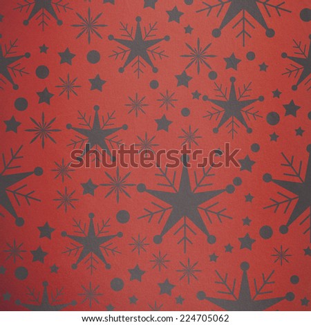 Snowflake pattern against orange