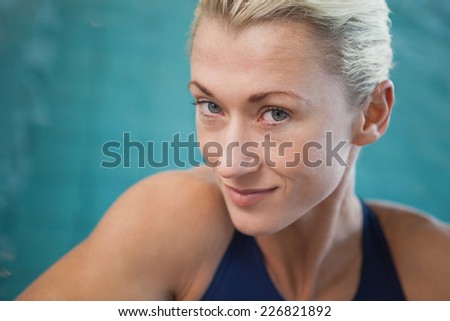 Close-up portrait of a female swimmer by the pool at leisure center