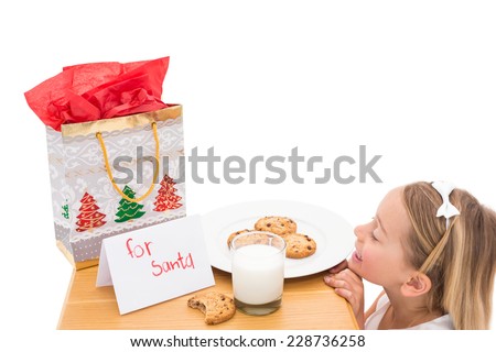 Milk and cookies left out for santa on white background