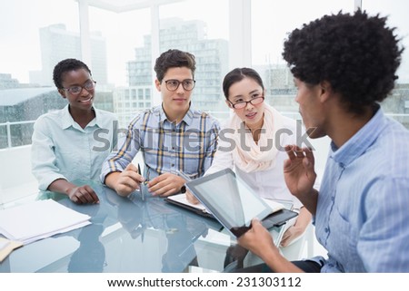 Casual business team having a meeting in creative office