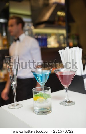 Three color cocktails preparing on the bar counter in a bar
