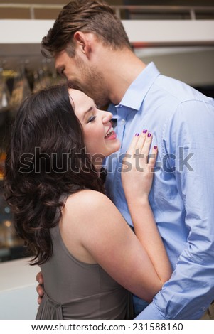 Cute couple slow dancing together at the nightclub