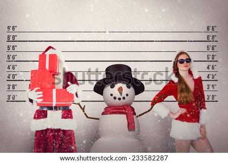 Santa covers his face with presents against mug shot background