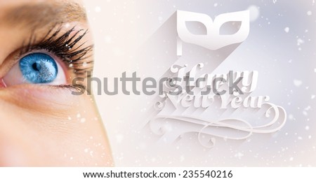 Blue eye looking up on female face against purple vignette