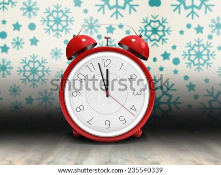 Alarm clock counting down to twelve against snowflake wallpaper over floor boards