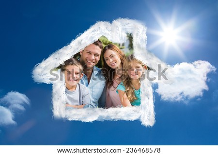 Family enjoying the sun against bright blue sky with clouds