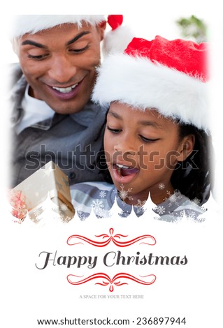 Portrait of an father and son opening a Christmas gift against border