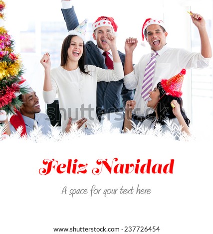 Business team punching the air to celebrate christmas against feliz navidad