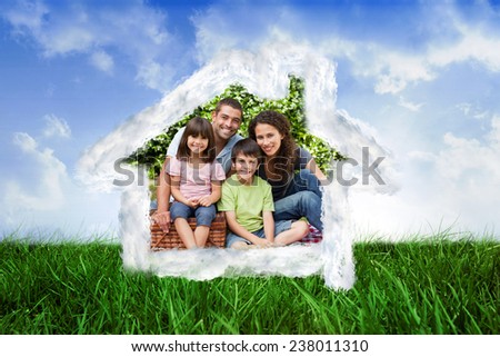 House outline in clouds against scenic landscape