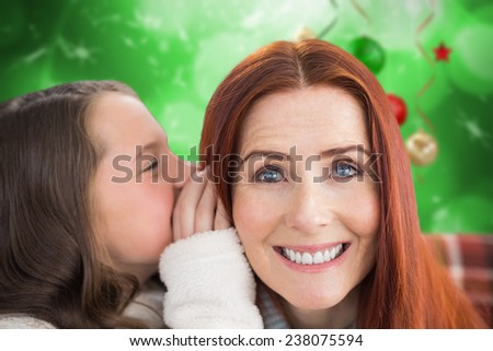 Mother and daughter telling secrets against blurred christmas background