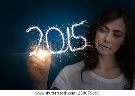 Businesswoman touching spark against blue background with vignette