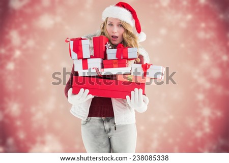 Blonde woman in trouble holding pile of gifts against white snowflake design on red