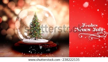 Snow falling against christmas tree in snow globe