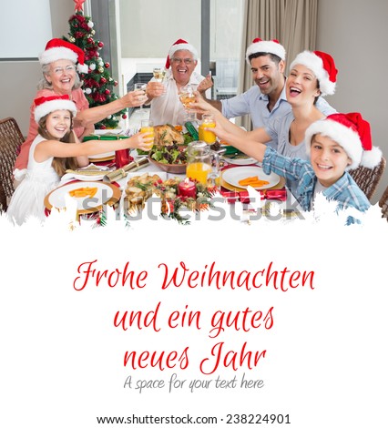 Family in santas hats toasting wine glasses at dining table against christmas greeting in german