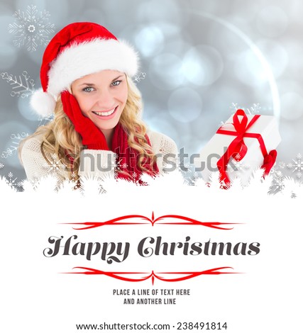 happy festive blonde with gift against border