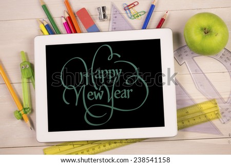 happy new year against students desk with tablet pc