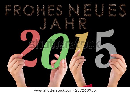 Hands holding poster against glittering frohes neues jahr