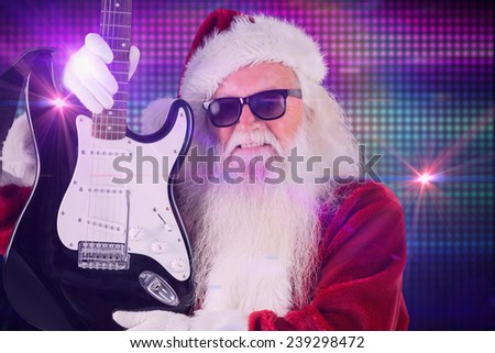 Father Christmas shows a guitar against digitally generated cool disco background