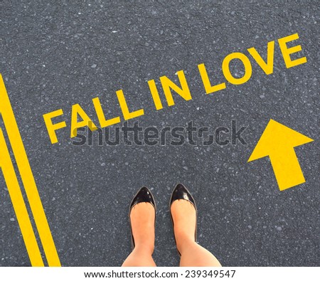 Businesswomans feet against road