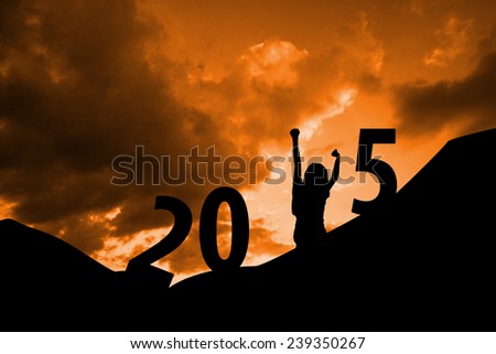 Cheering female silhouette against cloudy background