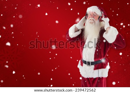 Santa Claus enjoys some music against red snowflake background
