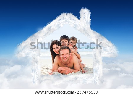 Family on the beach against blue sky over clouds