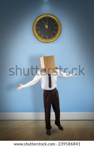 Anonymous businessman with arms out against blue room with wooden floor