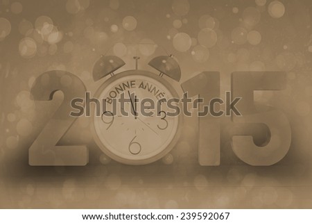 2015 with alarm clock against pink abstract light spot design