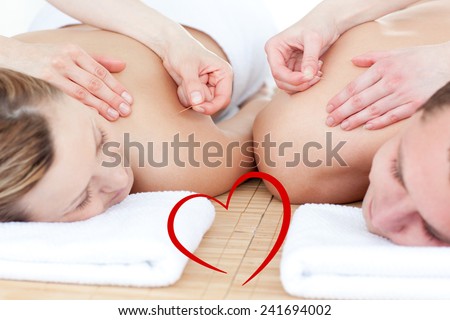 Relaxed couple in an acupuncture therapy against heart