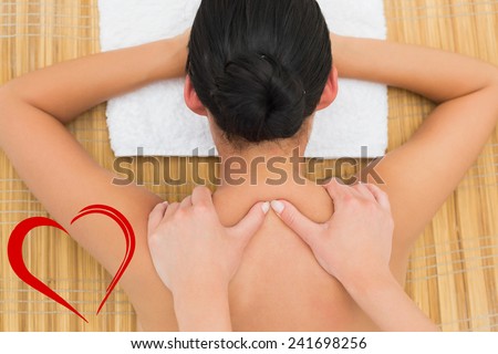 Peaceful brunette enjoying a back massage against heart