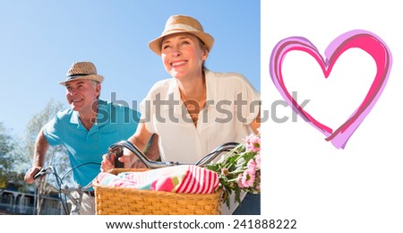 Happy senior couple going for a bike ride in the city against heart