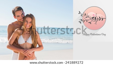 Athletic couple smiling at camera against love birds